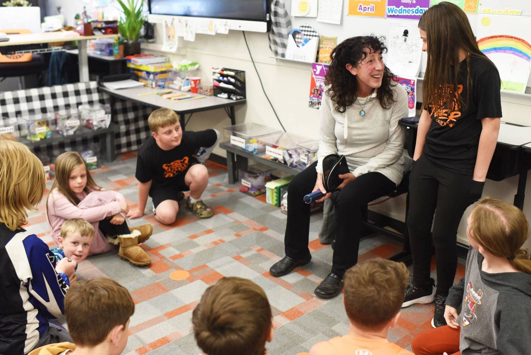 Tajali talking with students in her classroom